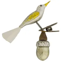 kleiner gelber Vogel aus Glas mit Glasfaserschweif auf nostalgischem Zwicker und silberner Eichel